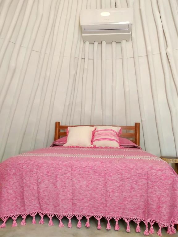 Una cama o camas en una habitación de Mimosa Tulum
