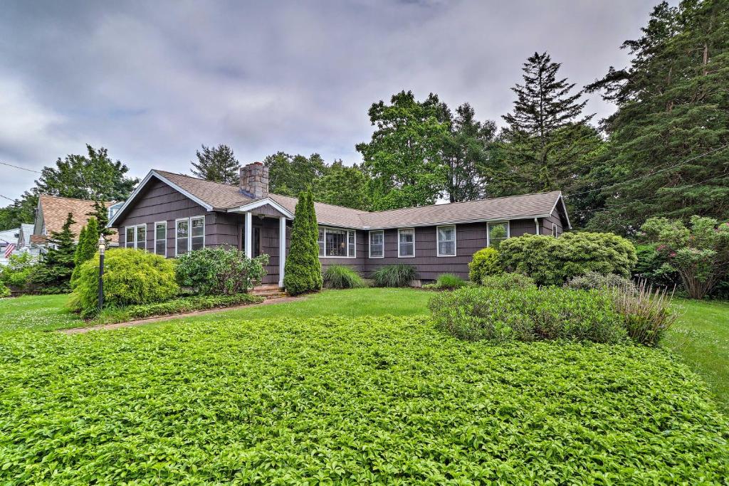 a house with a large yard in front of it at Saybrook Manor House, Walk to Cove Beach! in Old Saybrook