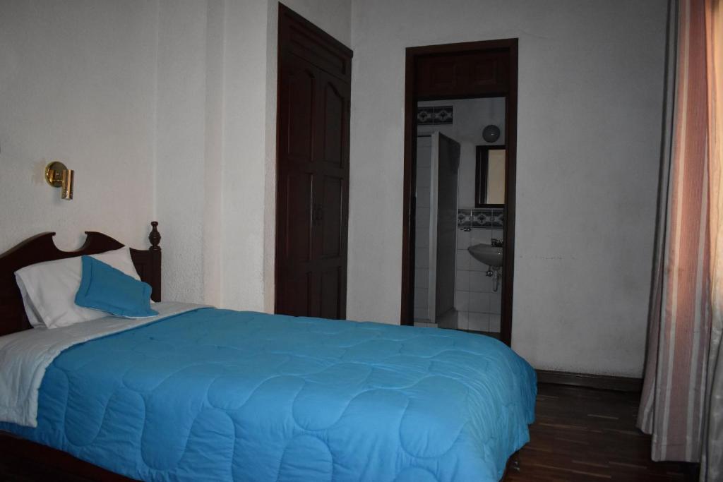 Postel nebo postele na pokoji v ubytování Hotel Huasi Continental
