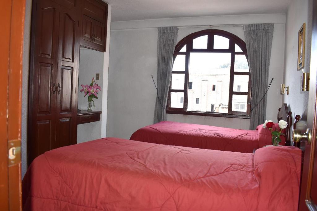 Postel nebo postele na pokoji v ubytování Hotel Huasi Continental