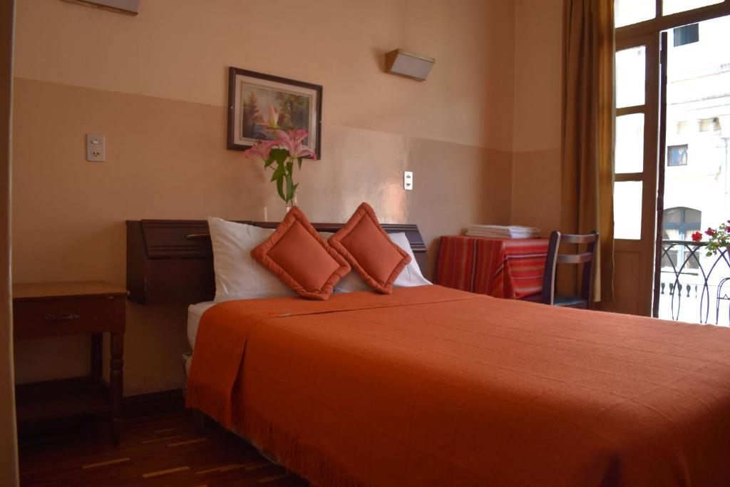 Postel nebo postele na pokoji v ubytování Hotel Huasi Continental