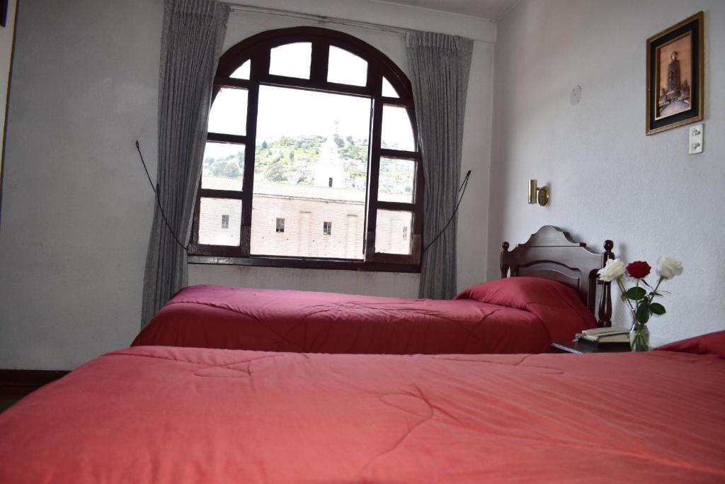 Postel nebo postele na pokoji v ubytování Hotel Huasi Continental