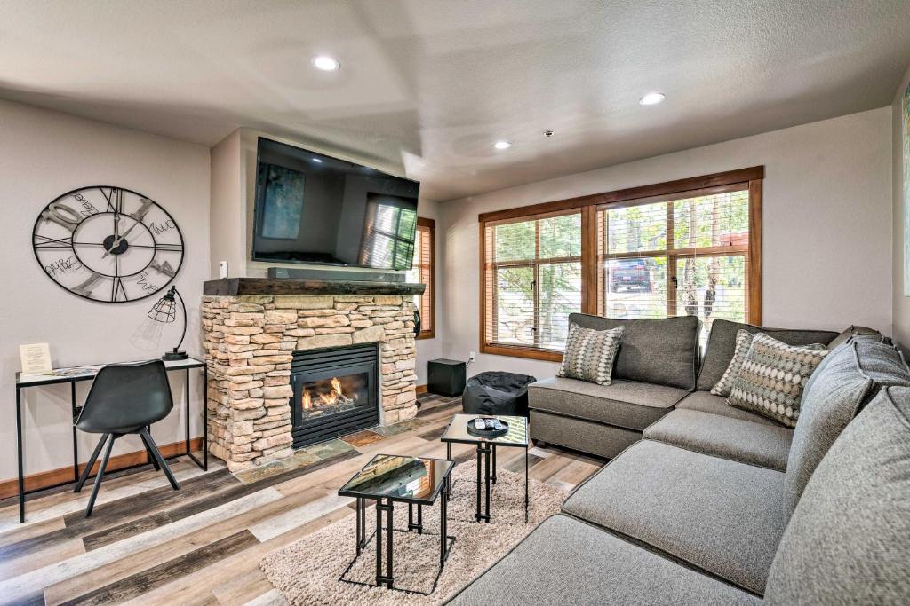 a living room with a couch and a fireplace at Solitude Mountain Resort Condo at Lift Base! in Solitude