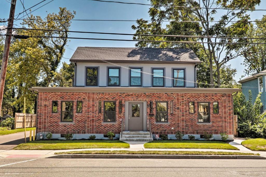 a red brick house with a gray roof at Updated Downtown Red Bank Home 5 Mi to Beach! in Red Bank