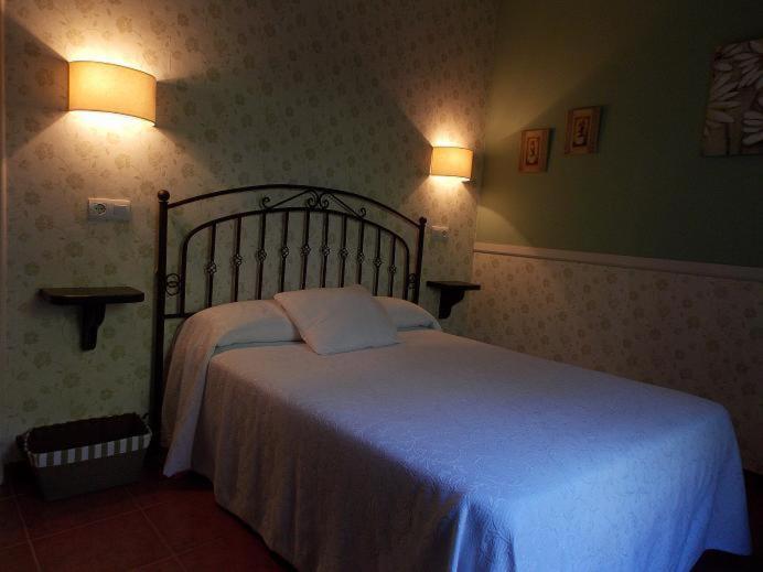 Postel nebo postele na pokoji v ubytování Apartamentos Guidan