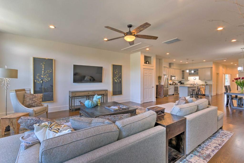 a living room with two couches and a fireplace at Modern Main St Apt in Downtown Waynesville! in Waynesville