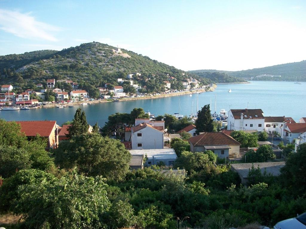 a view of a town and a body of water at Apartments Luka in Tisno