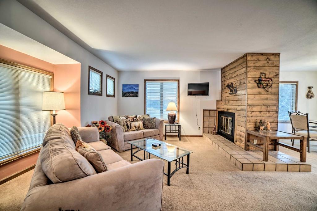 a living room with a couch and a fireplace at Pagosa Springs Condo, 4 Miles to Hot Springs! in Pagosa Springs