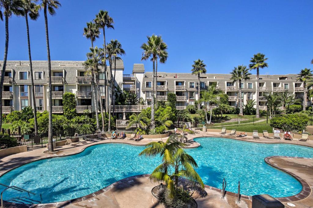 an image of a swimming pool at a resort at Beachfront Oceanside Condo with Pool and Hot Tub! in Oceanside