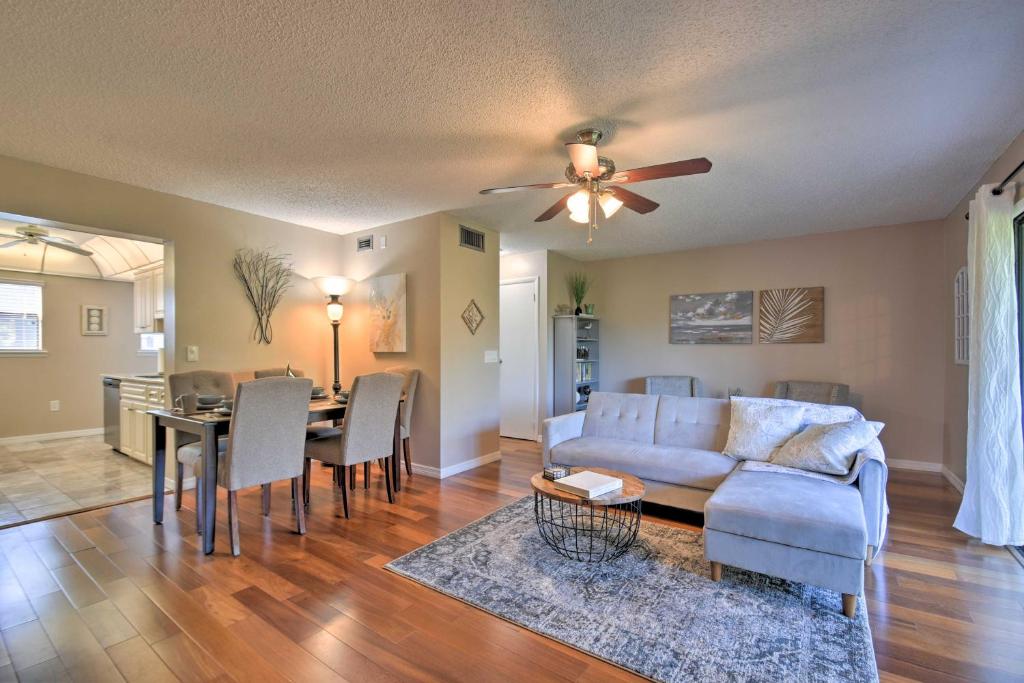 a living room with a couch and a table at Indian Shores Townhome with Pool Access and Kayaks! in Clearwater Beach