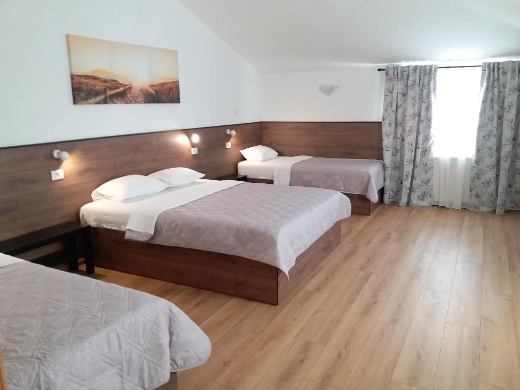 Postel nebo postele na pokoji v ubytování Konak Vukasinovic