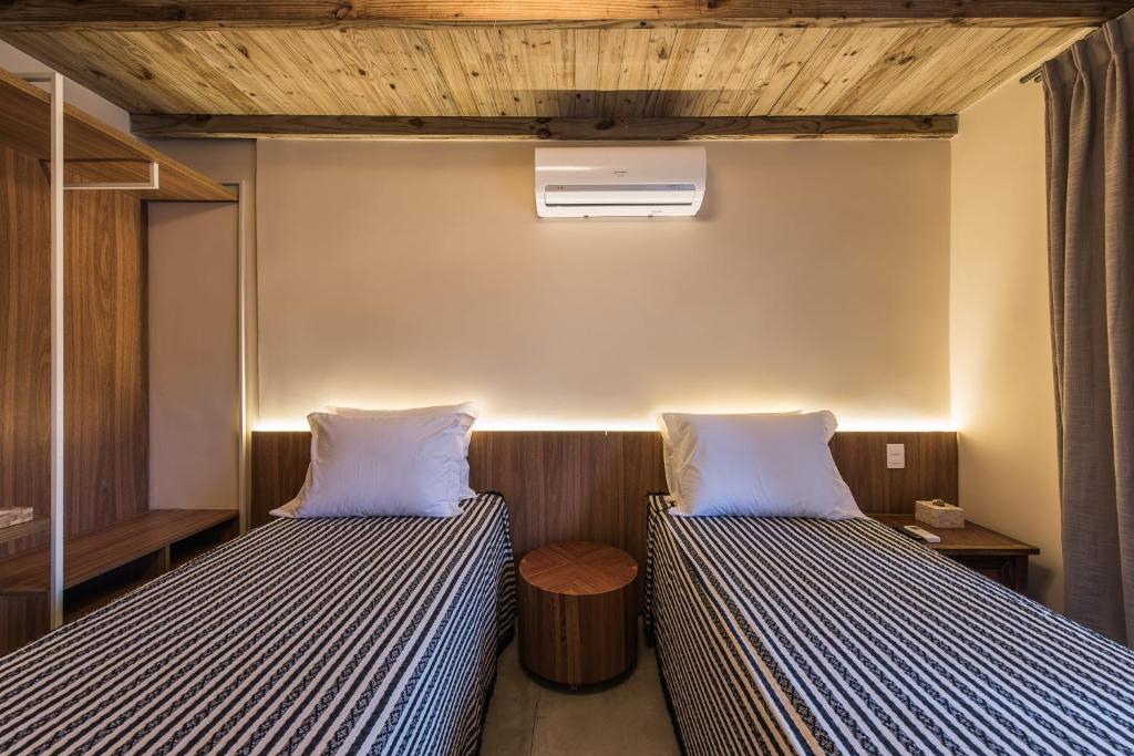 Postel nebo postele na pokoji v ubytování Vila Sal Noronha
