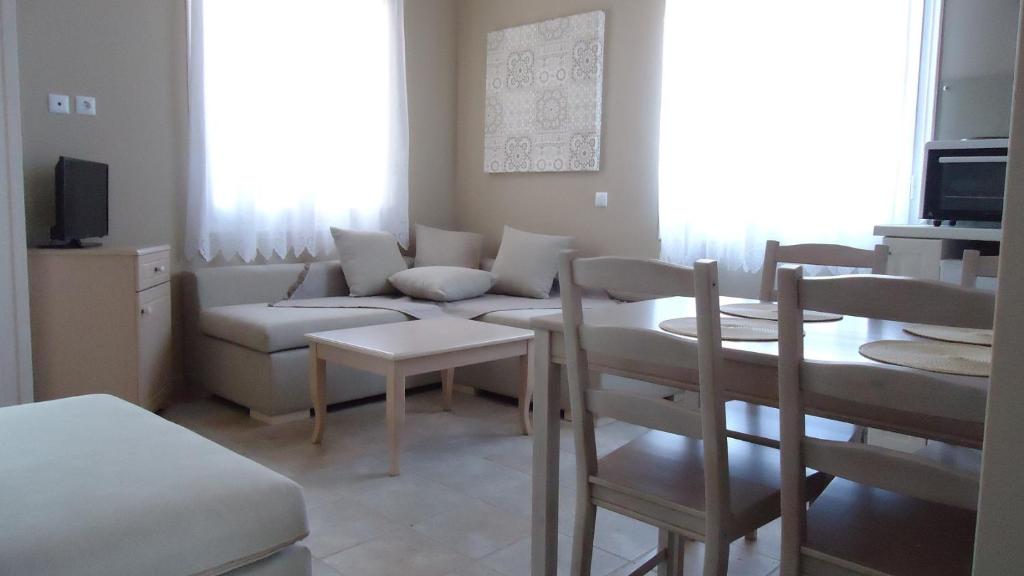 a living room with a couch and a table at House of Garden in Dhráganon
