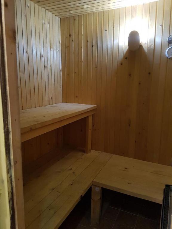 a small wooden sauna with a bench in it at Rogla - Chalet Mojca Pokrajculja in Zreče