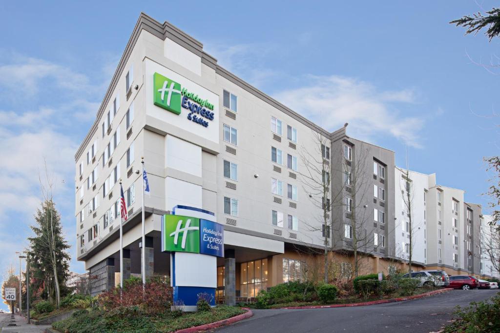 a hotel building with a sign in front of it at Holiday Inn Express Seattle - Sea-Tac Airport, an IHG Hotel in SeaTac