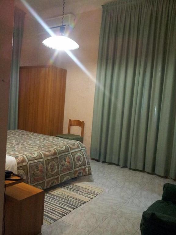 Posteľ alebo postele v izbe v ubytovaní Hotel Acapulco