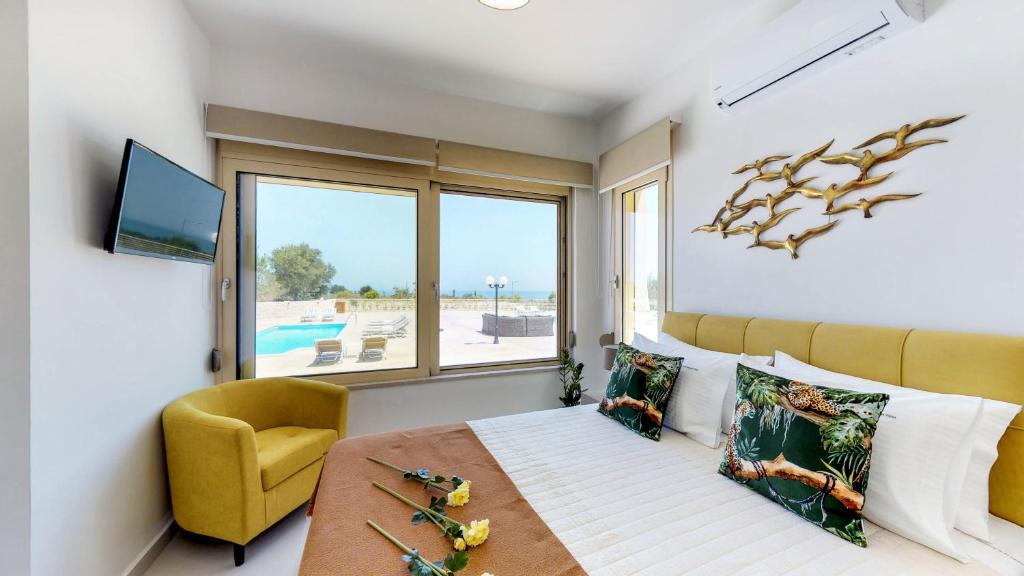Televízia a/alebo spoločenská miestnosť v ubytovaní Liberty & Freedom Luxury Villas