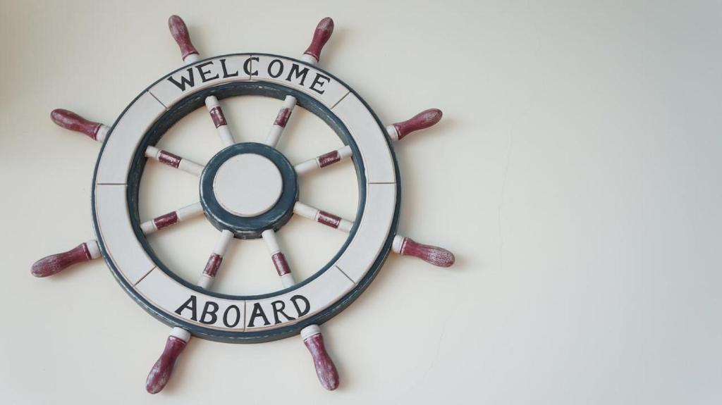 a wall clock with the welcome aboard sign at HL Sea Homestay in Hualien City