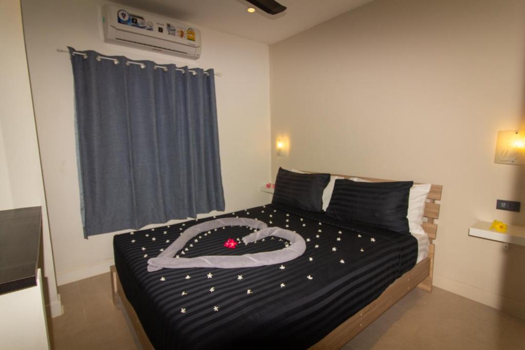Postel nebo postele na pokoji v ubytování Aussieland Bungalows