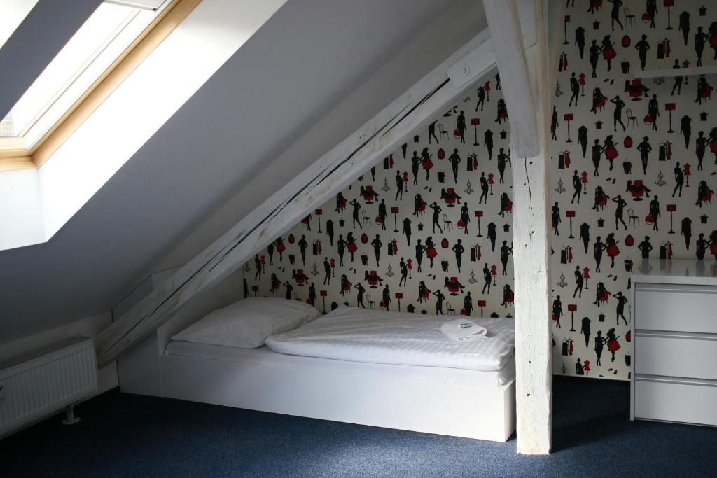 Postel nebo postele na pokoji v ubytování ADC Design Apartmány