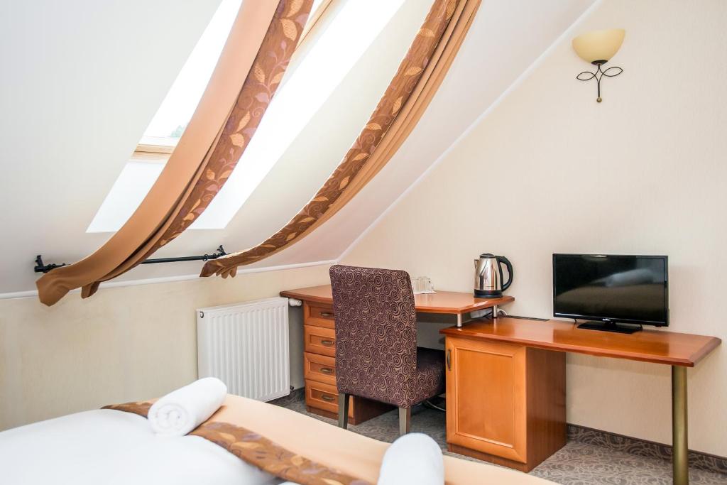 TV a/nebo společenská místnost v ubytování Hotel Narád