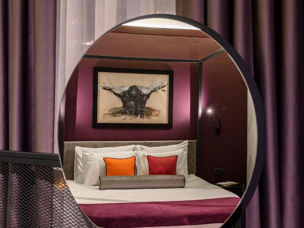 Postel nebo postele na pokoji v ubytování ArtLoft Garni Hotel