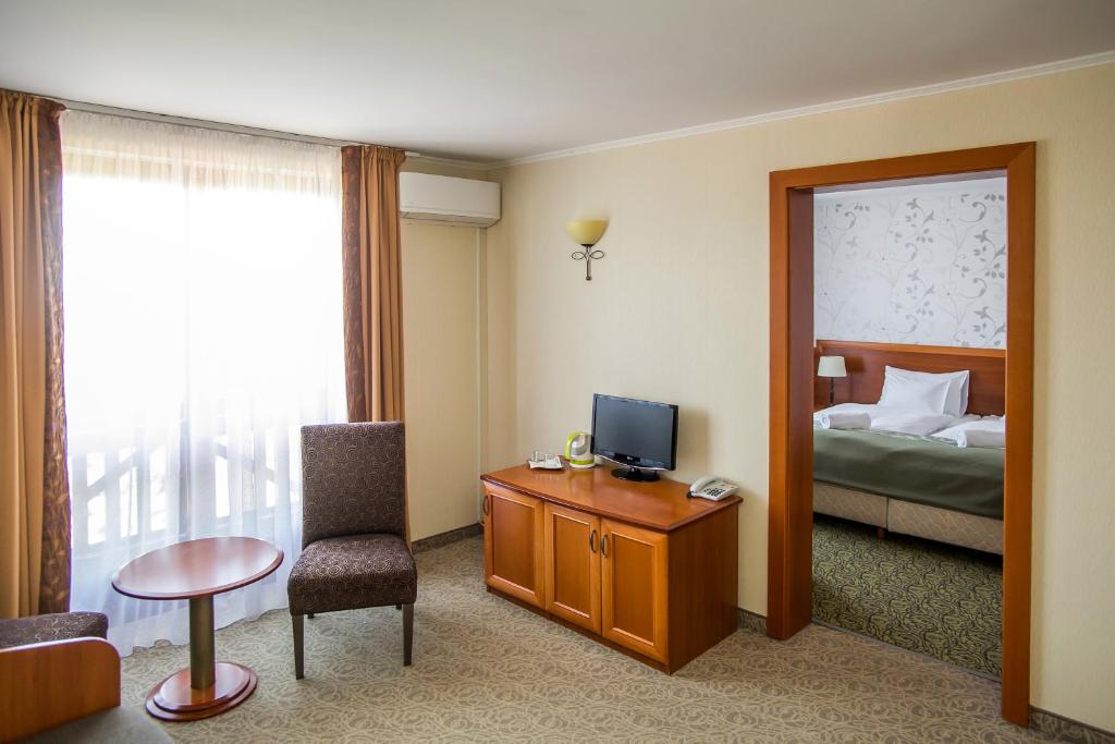 Postel nebo postele na pokoji v ubytování Hotel Narád