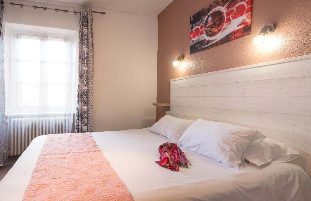 Postel nebo postele na pokoji v ubytování Hotel Astoria