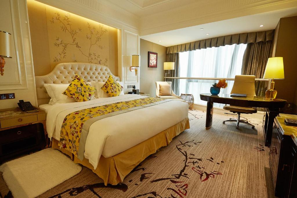 Postel nebo postele na pokoji v ubytování Estandon Hotel Guangzhou