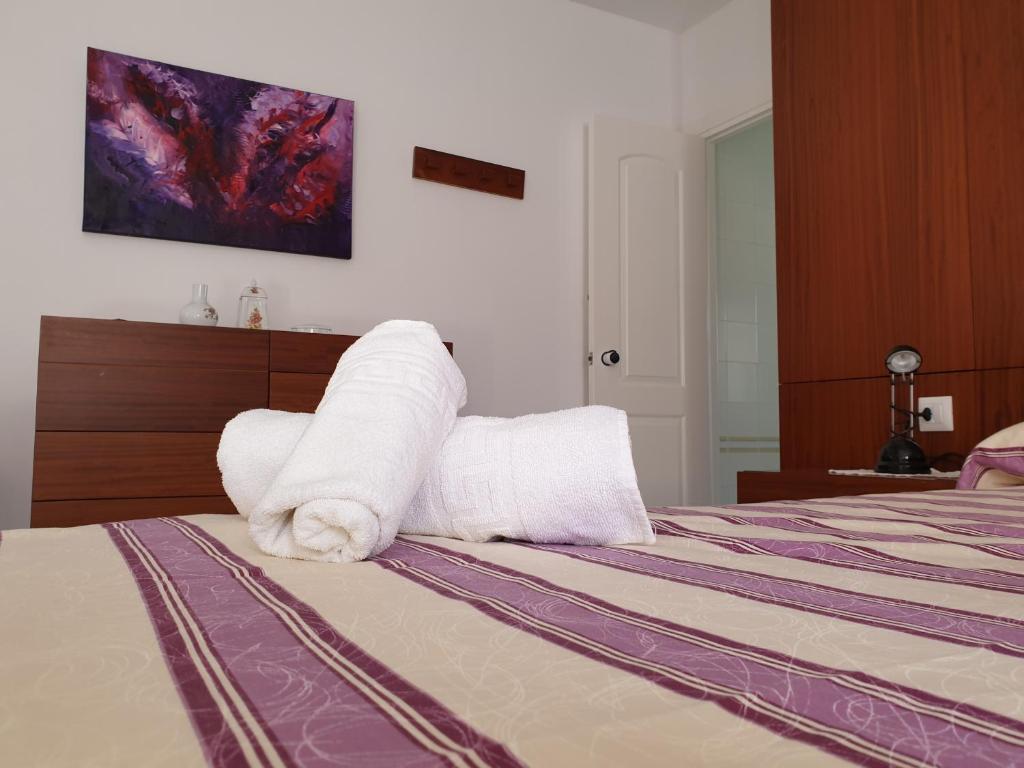 Postel nebo postele na pokoji v ubytování Villa Piscis