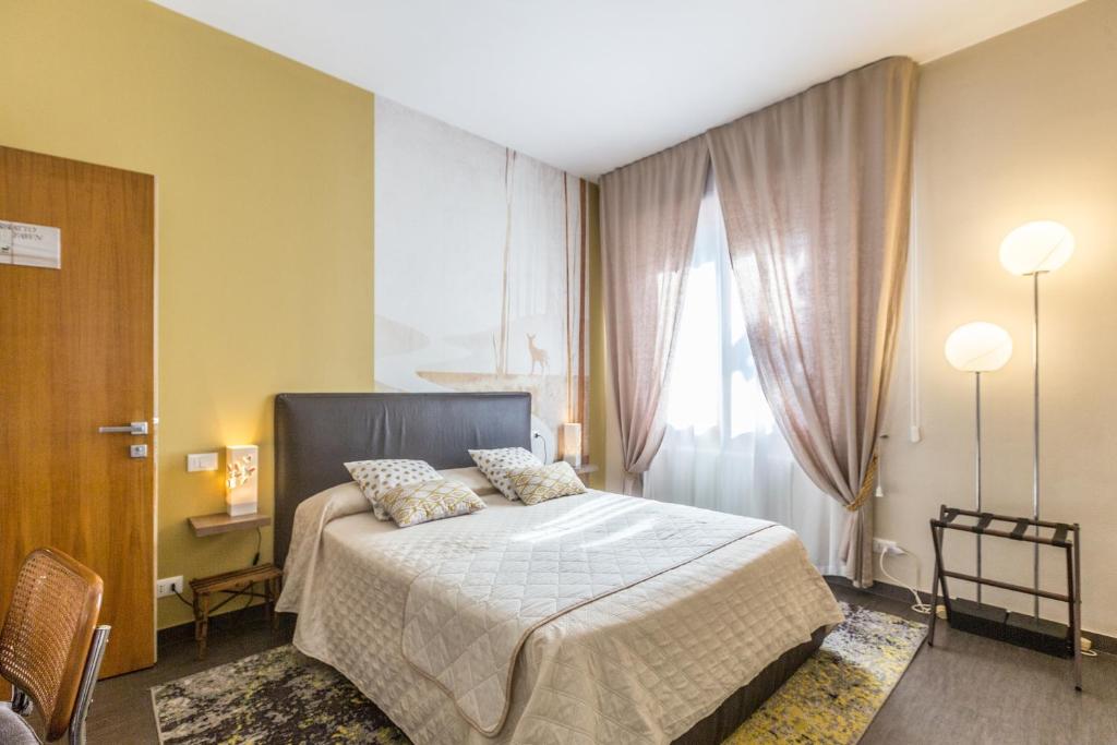 Postel nebo postele na pokoji v ubytování B&b Igea 50