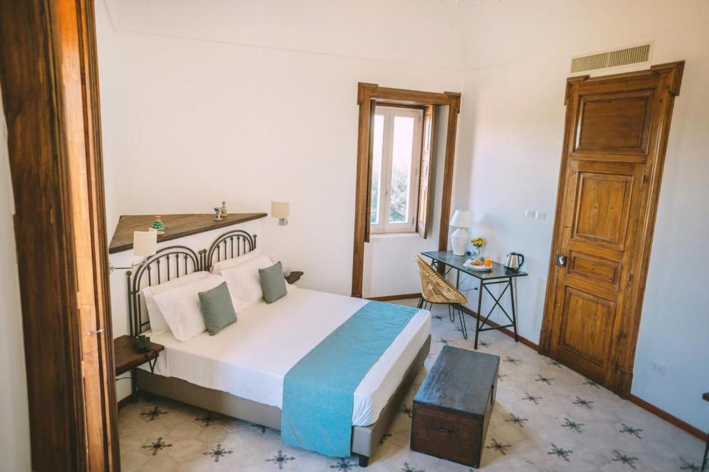 Postel nebo postele na pokoji v ubytování Masseria Testaferrata