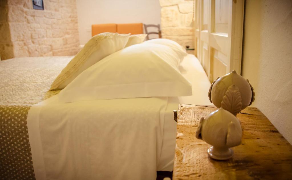 Postel nebo postele na pokoji v ubytování Trulli Soave