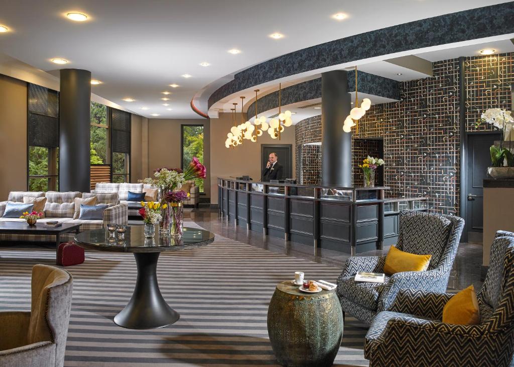 a lobby of a hotel with a person in the background at Tullamore Court Hotel in Tullamore