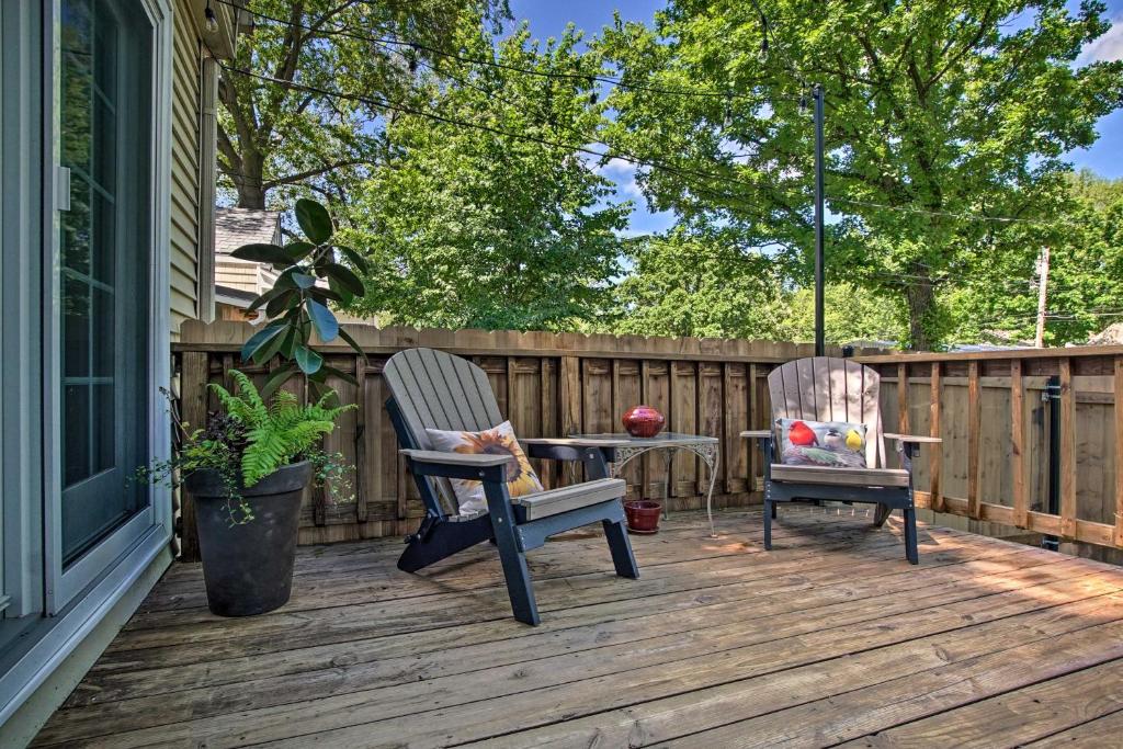two chairs and a table on a deck at Cute Emporia House - Mins to Downtown and ESU! in Emporia