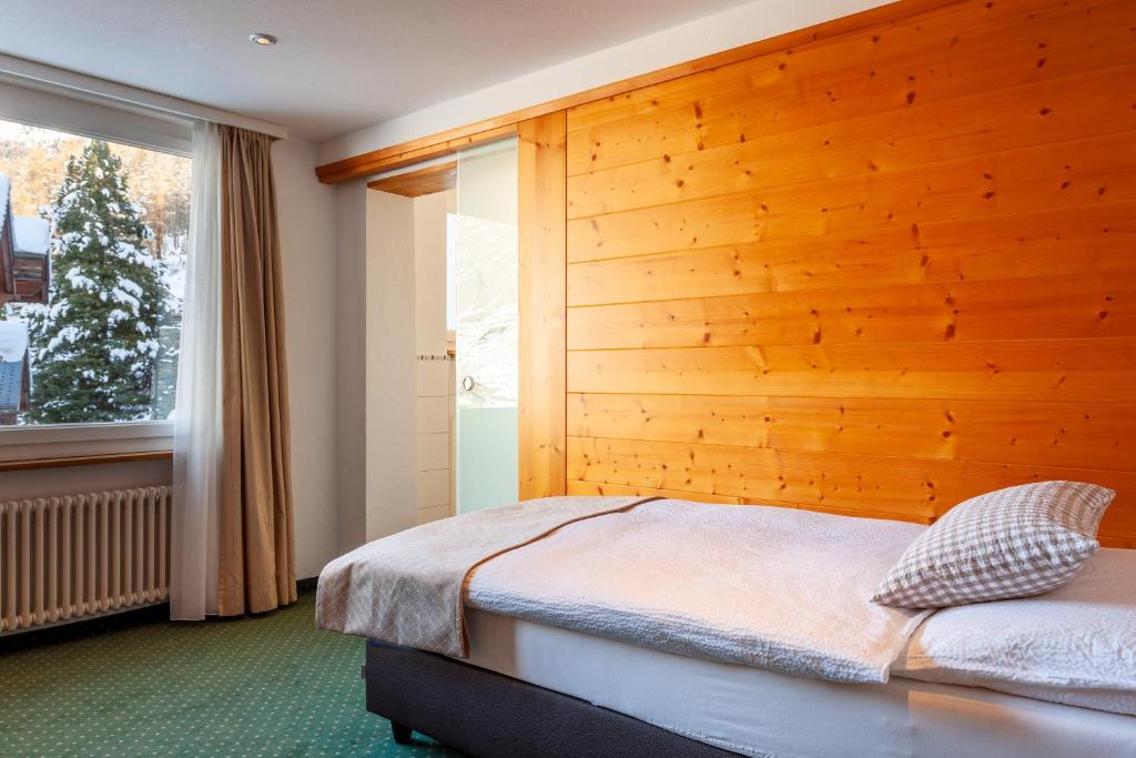 Ein Bett oder Betten in einem Zimmer der Unterkunft Hotel Jägerhof