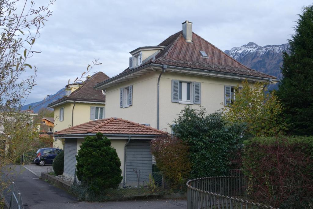 a small house with a view of the mountains at ARNOLDS Bed & Breakfast in Interlaken