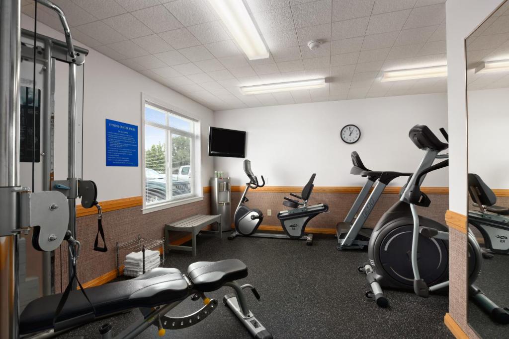a gym with several exercise bikes in a room at Days Inn by Wyndham Great Falls in Great Falls