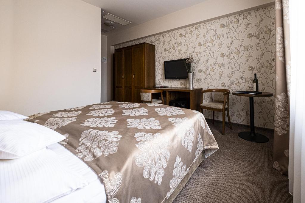 Postel nebo postele na pokoji v ubytování Hotel Mario