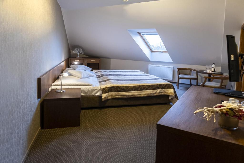 Postel nebo postele na pokoji v ubytování Hotel Mario