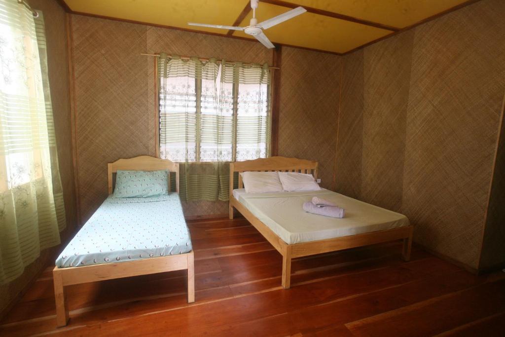 Postel nebo postele na pokoji v ubytování JJS BACKPACKERS VILLAGE