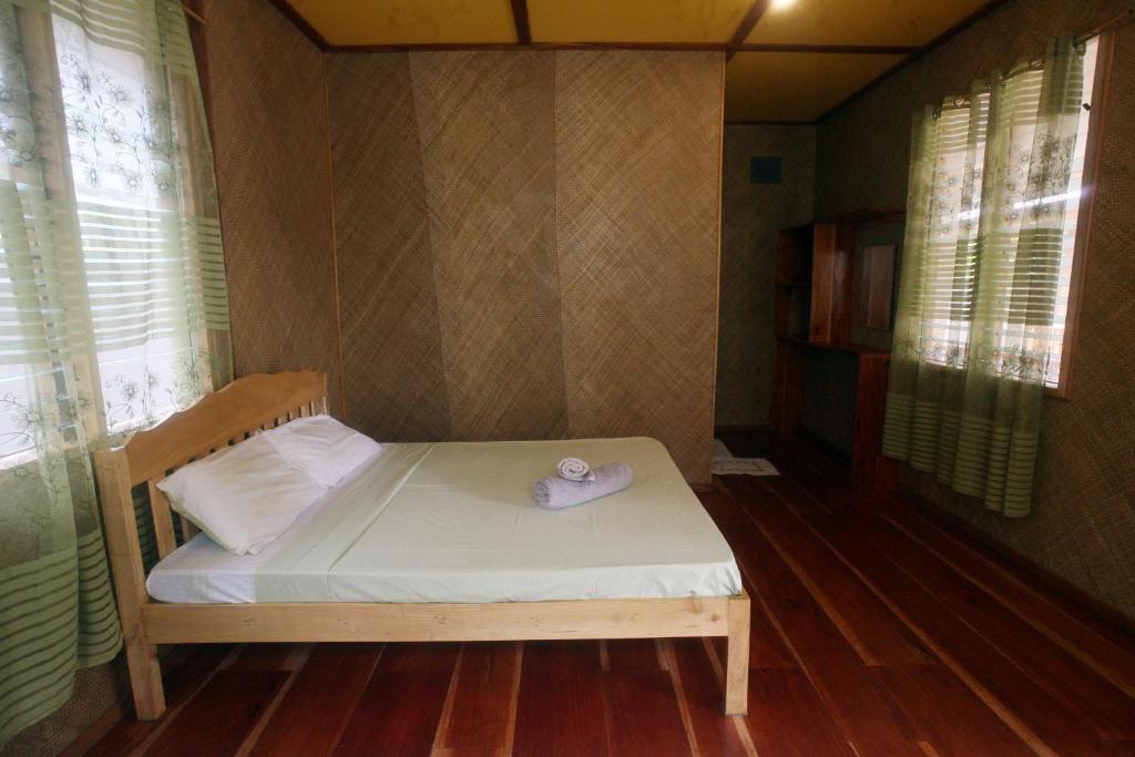 Postel nebo postele na pokoji v ubytování JJS BACKPACKERS VILLAGE
