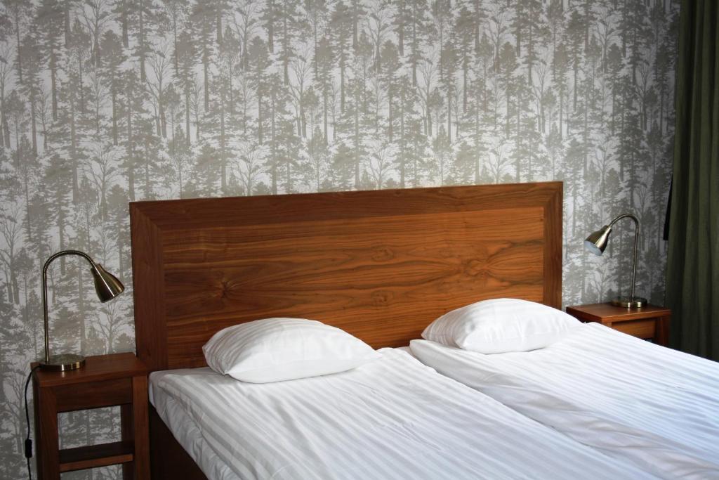 Postel nebo postele na pokoji v ubytování First Hotel City Eskilstuna