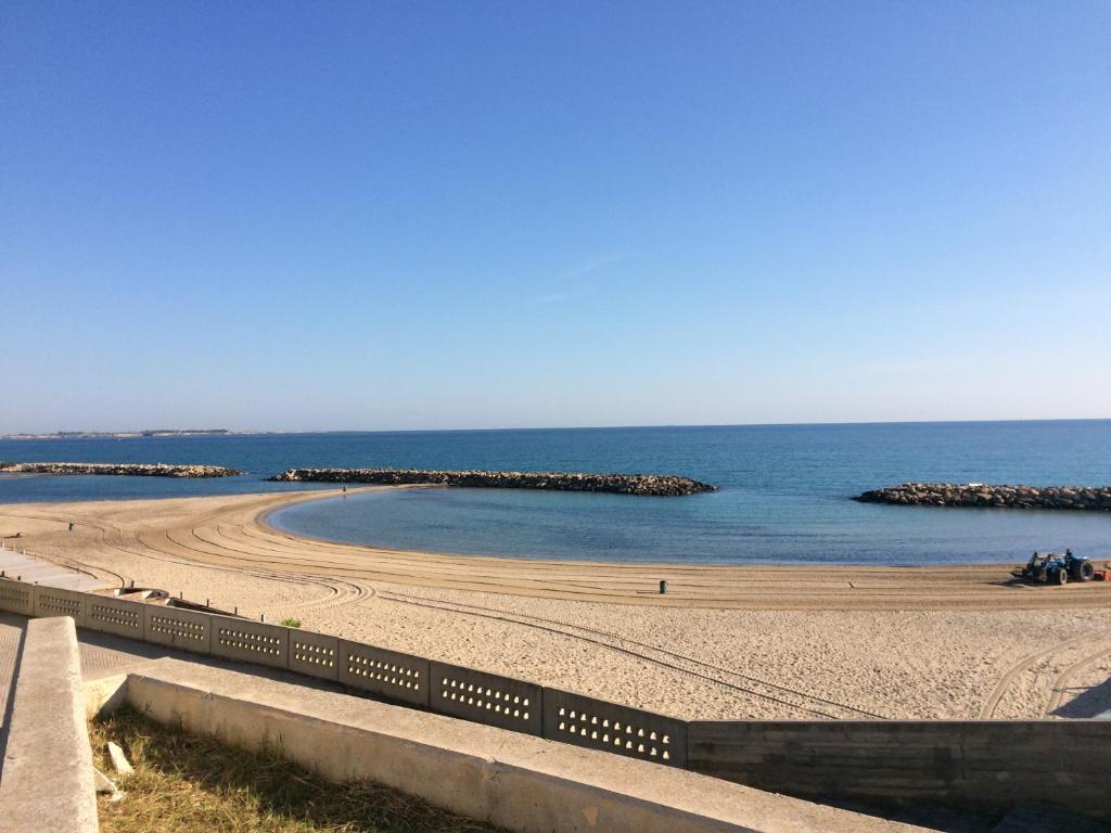 a view of a beach with rocks in the water at Dimore di Mare in San Pietro Vernotico
