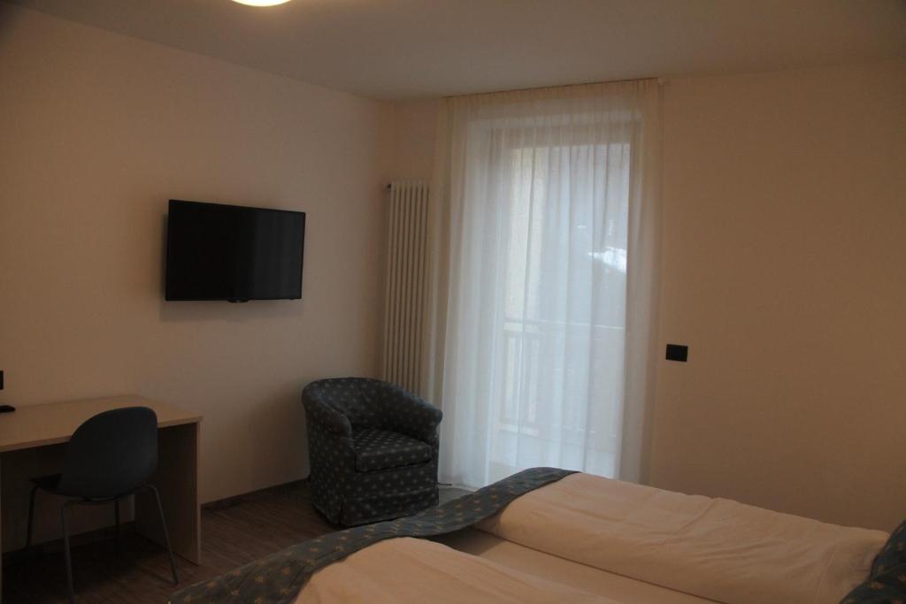 Televízia a/alebo spoločenská miestnosť v ubytovaní MOUNTAIN RESORT Appartamenti