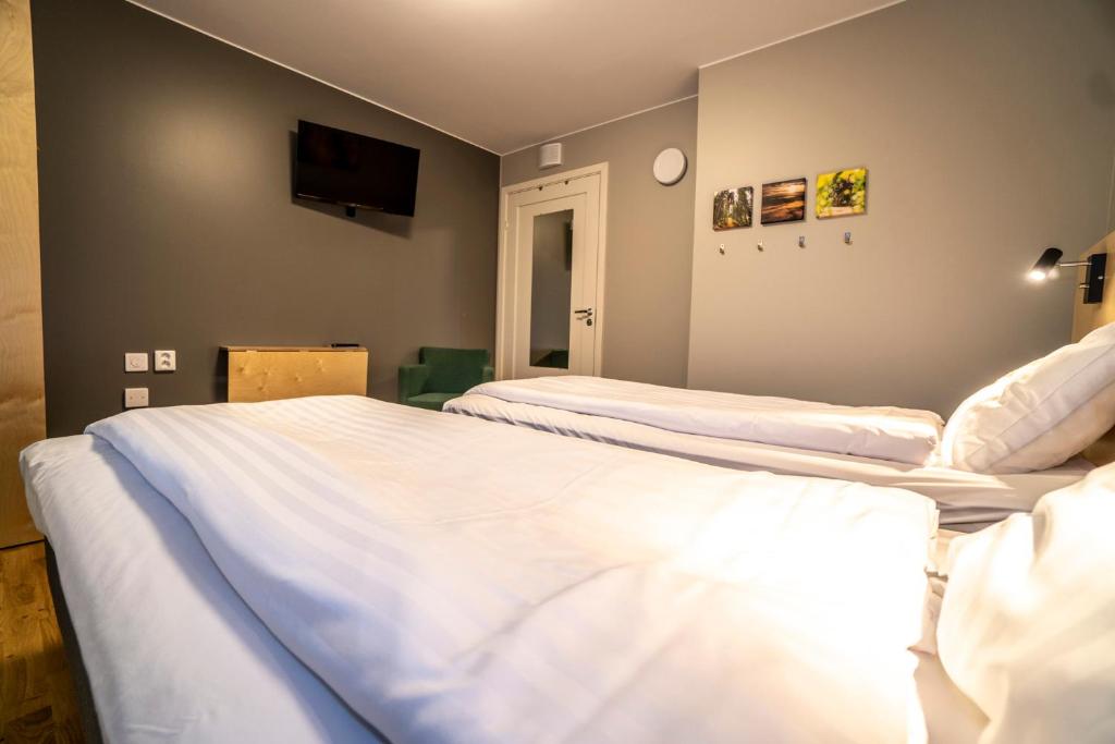 Postel nebo postele na pokoji v ubytování JBP Hotell