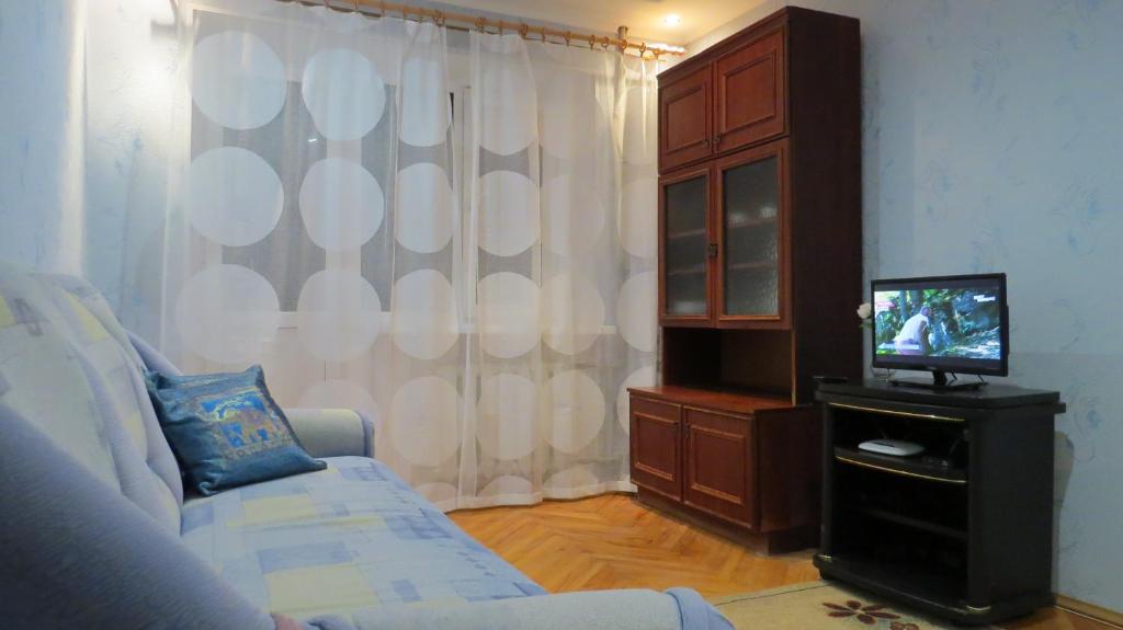 A bed or beds in a room at Apartment on Lenina