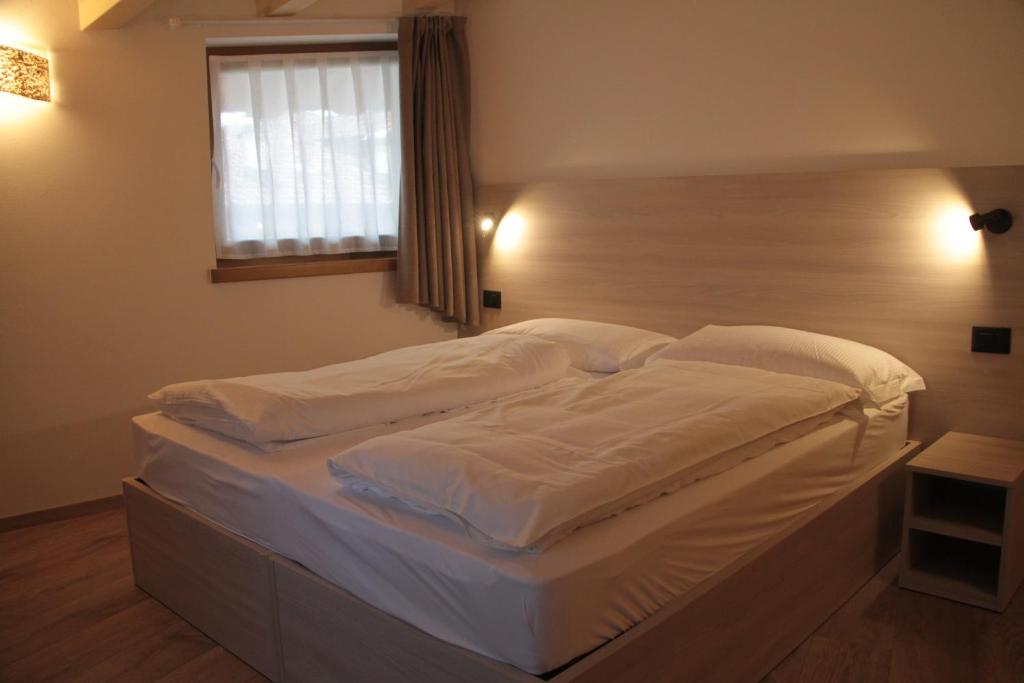 Posteľ alebo postele v izbe v ubytovaní MOUNTAIN RESORT Appartamenti