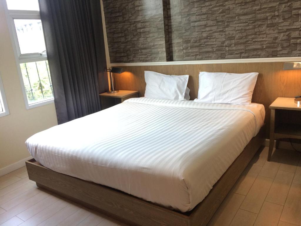 Postel nebo postele na pokoji v ubytování Bourbon St. Boutique Hotel