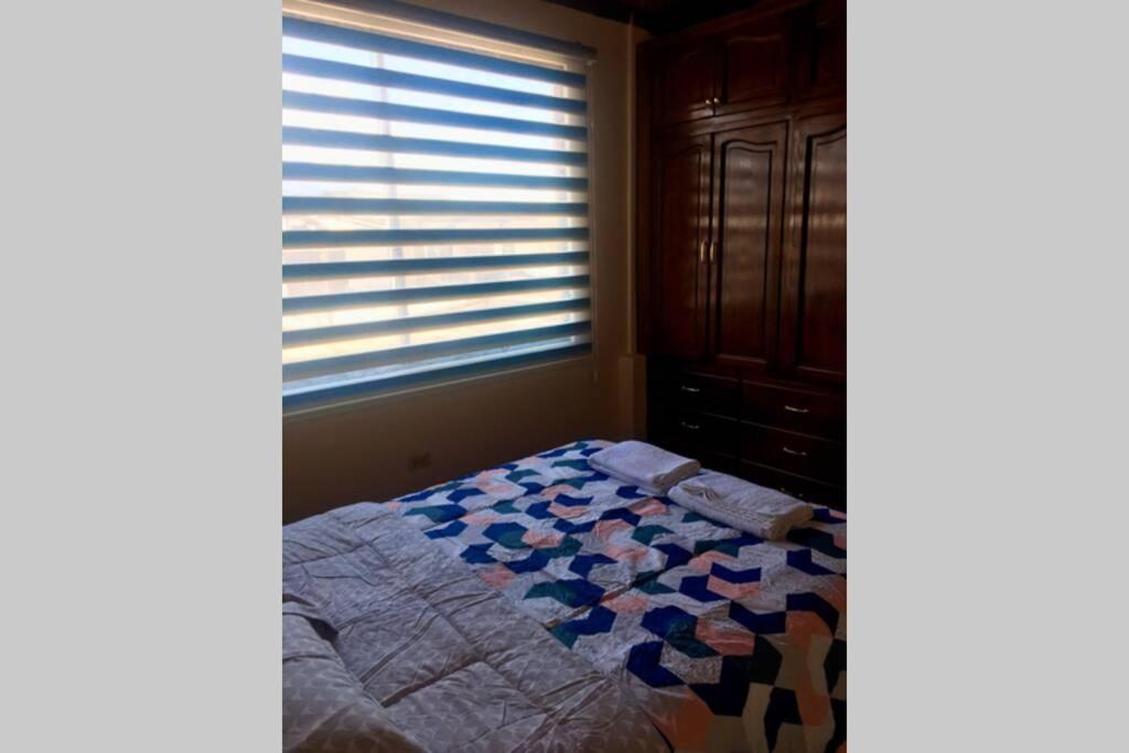 Postel nebo postele na pokoji v ubytování Confortable mini departamento